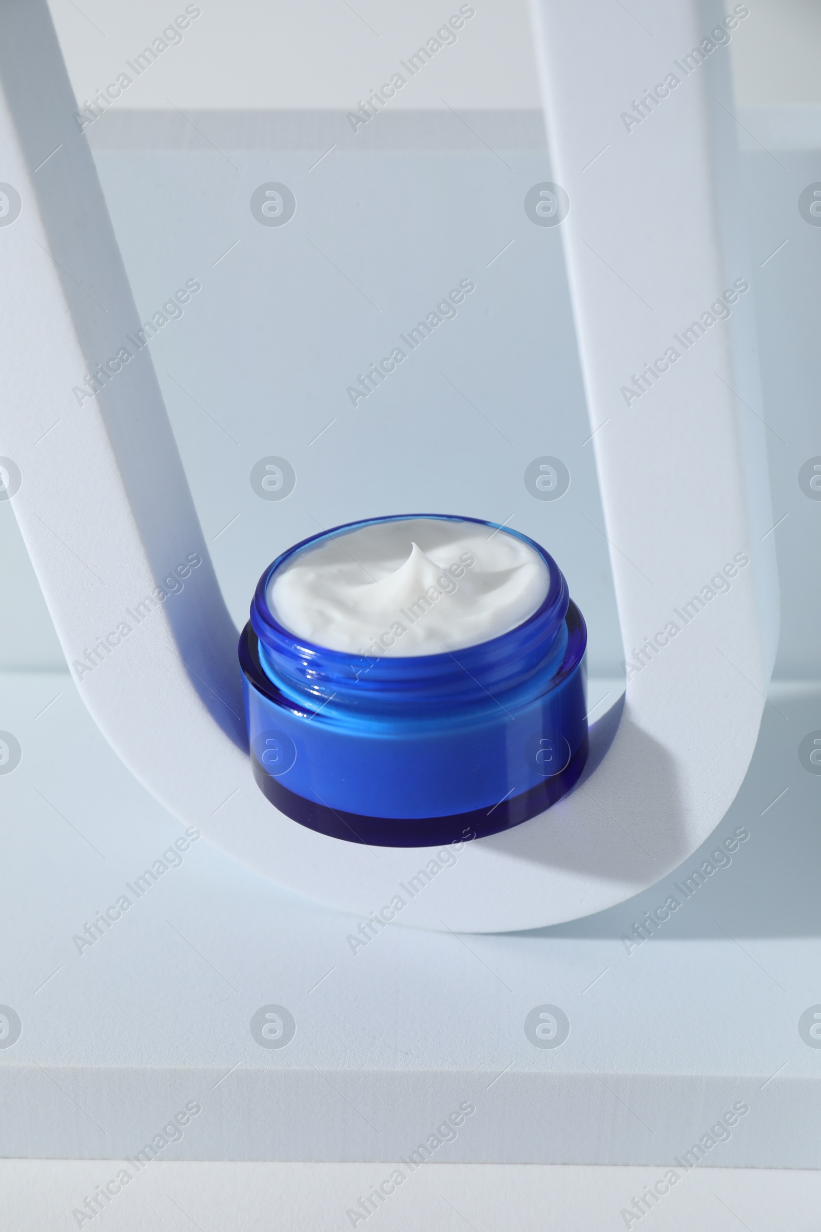 Photo of Stylish presentation of facial cream on white background