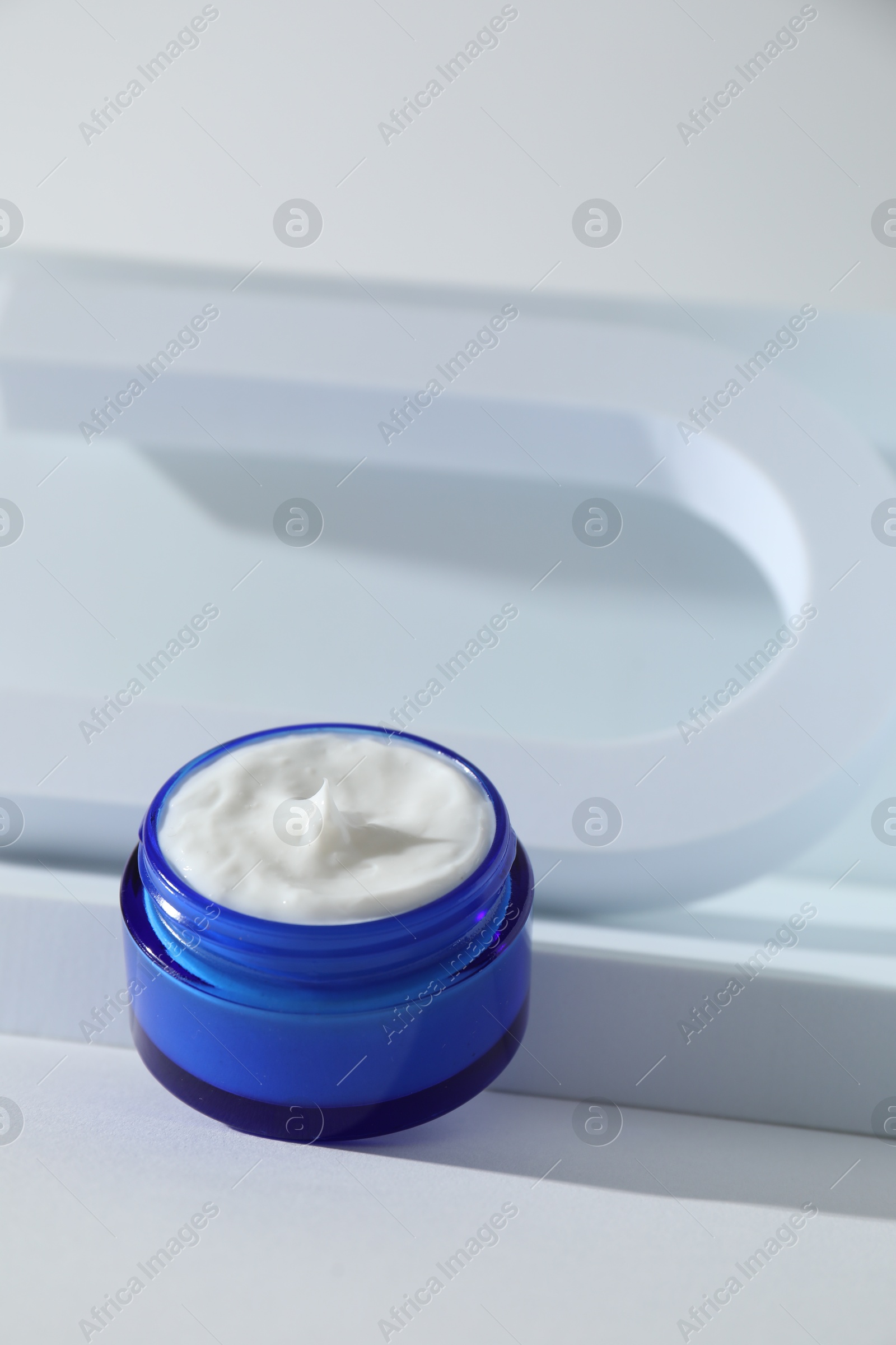 Photo of Stylish presentation of facial cream on white background