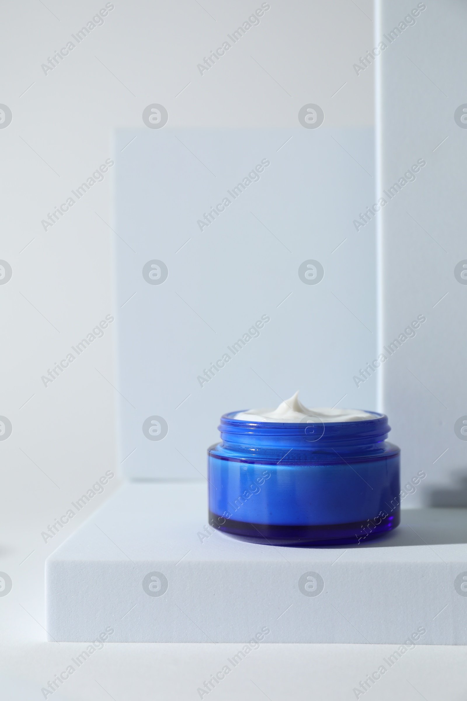 Photo of Stylish presentation of facial cream on white background