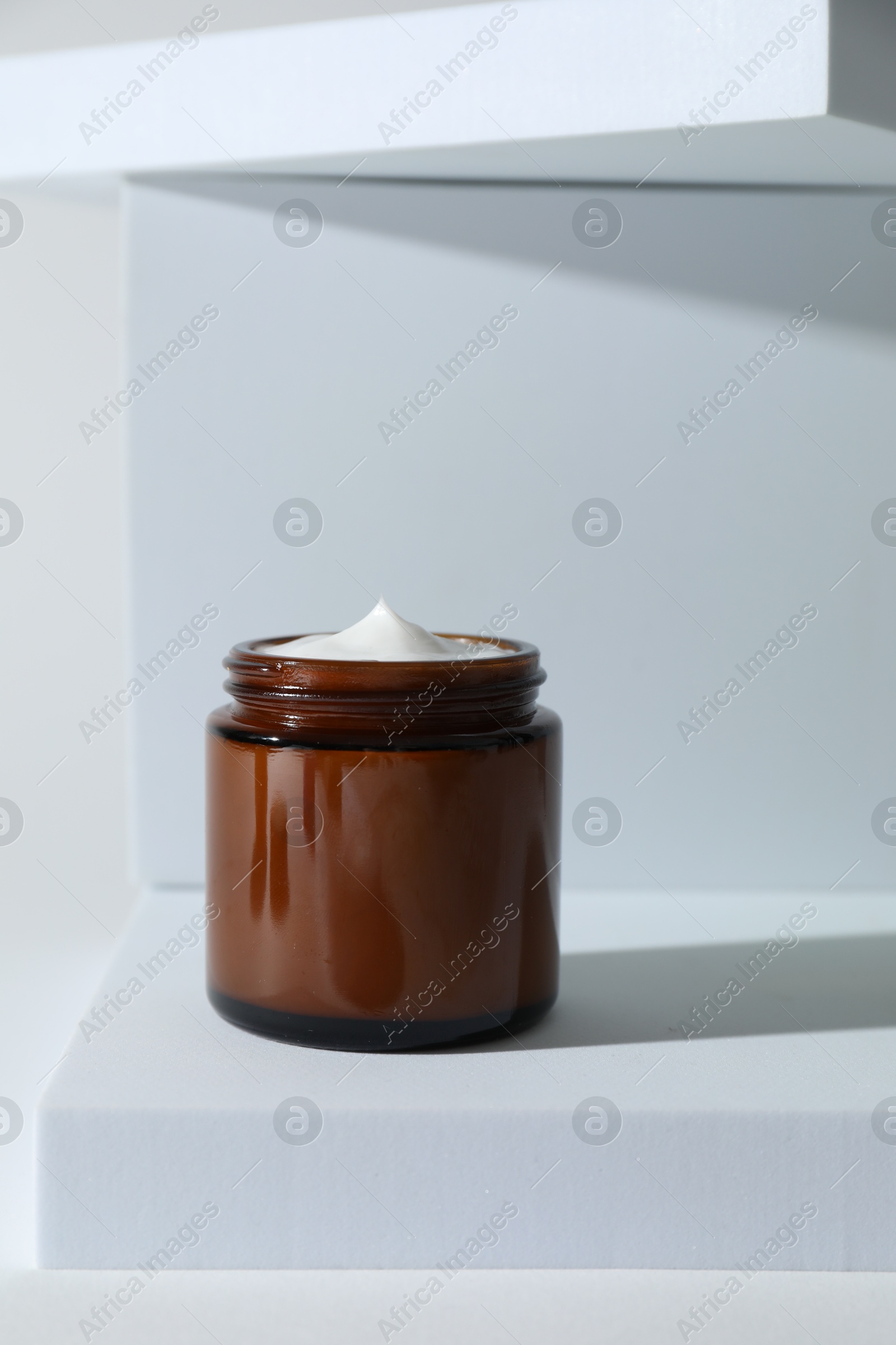 Photo of Stylish presentation of facial cream on white background