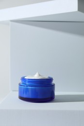 Photo of Stylish presentation of facial cream on white background