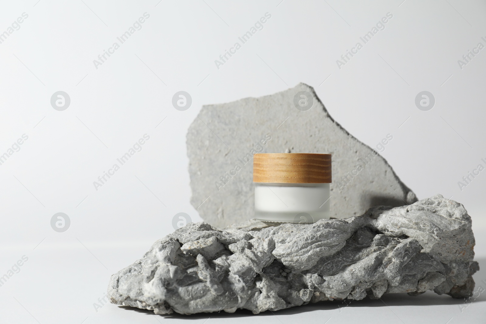 Photo of Stylish presentation of facial cream on white background