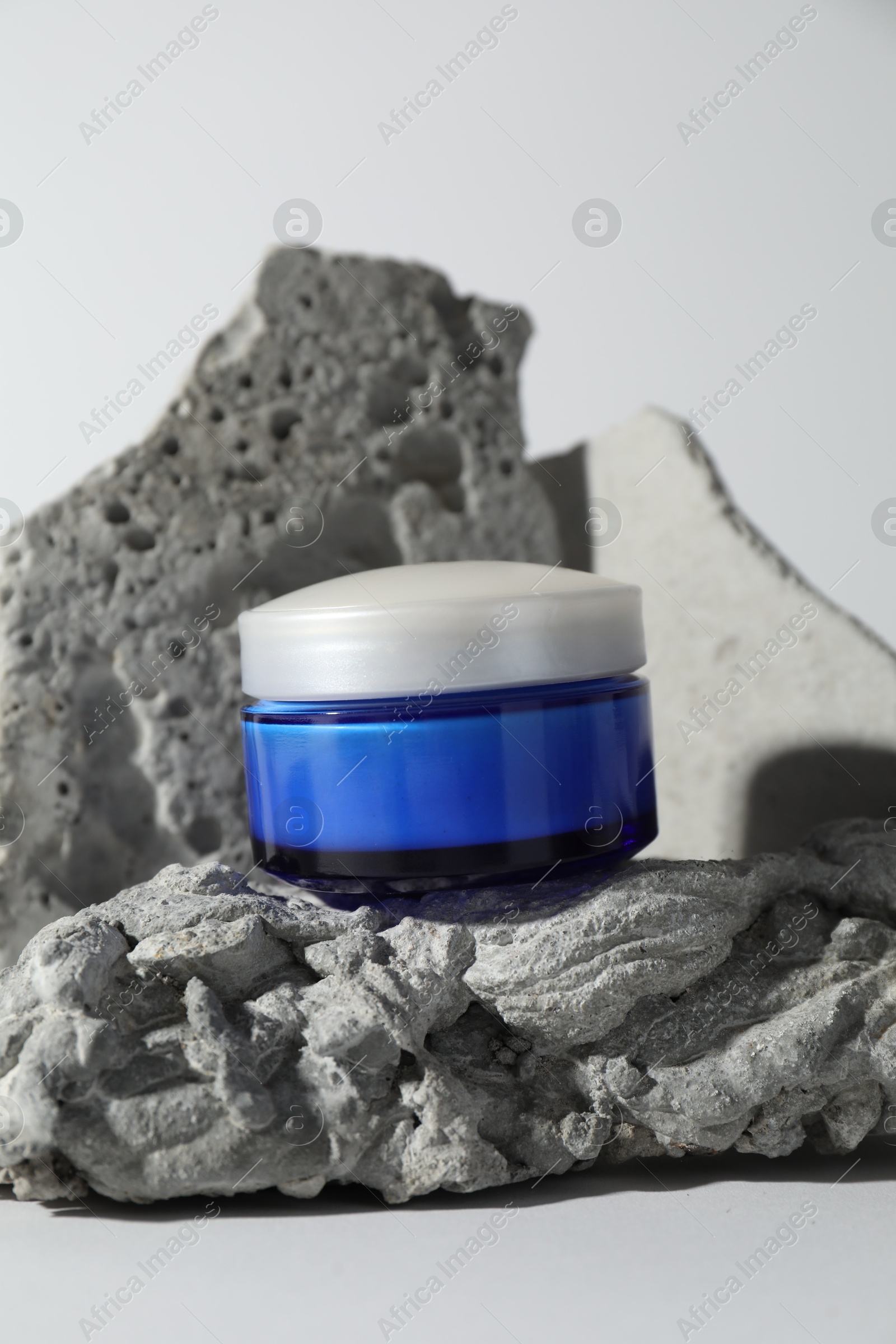 Photo of Stylish presentation of facial cream on white background