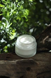 Stylish presentation of facial cream in jar outdoors