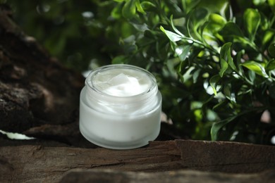 Stylish presentation of facial cream in jar outdoors