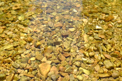 Beautiful mountain river with transparent water as background, closeup