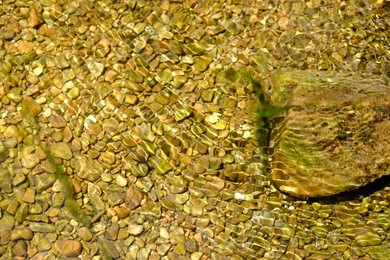 Photo of Beautiful mountain river with transparent water as background, closeup