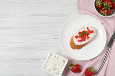 Photo of Delicious ricotta bruschetta with strawberry and mint on white wooden table, flat lay. Space for text