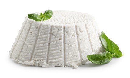 Photo of Tasty ricotta (cream cheese) and basil isolated on white