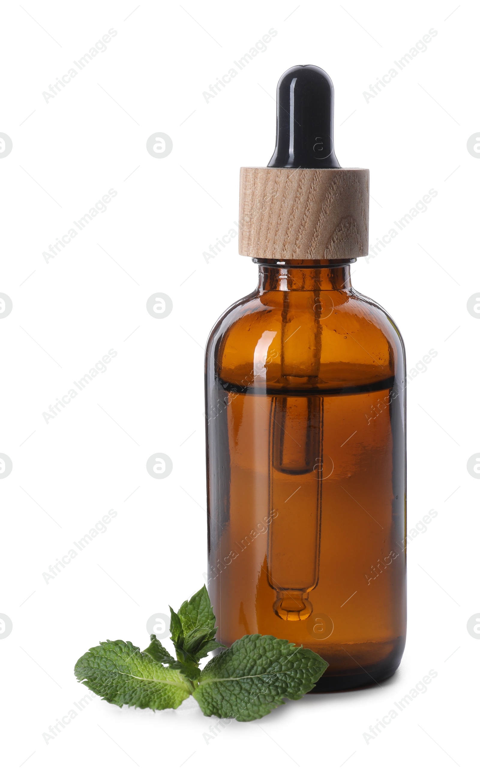 Photo of Bottle of essential oil and mint isolated on white