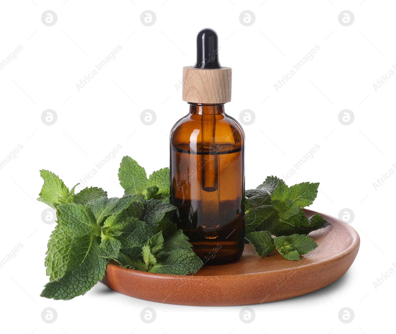 Photo of Bottle of essential oil and mint isolated on white