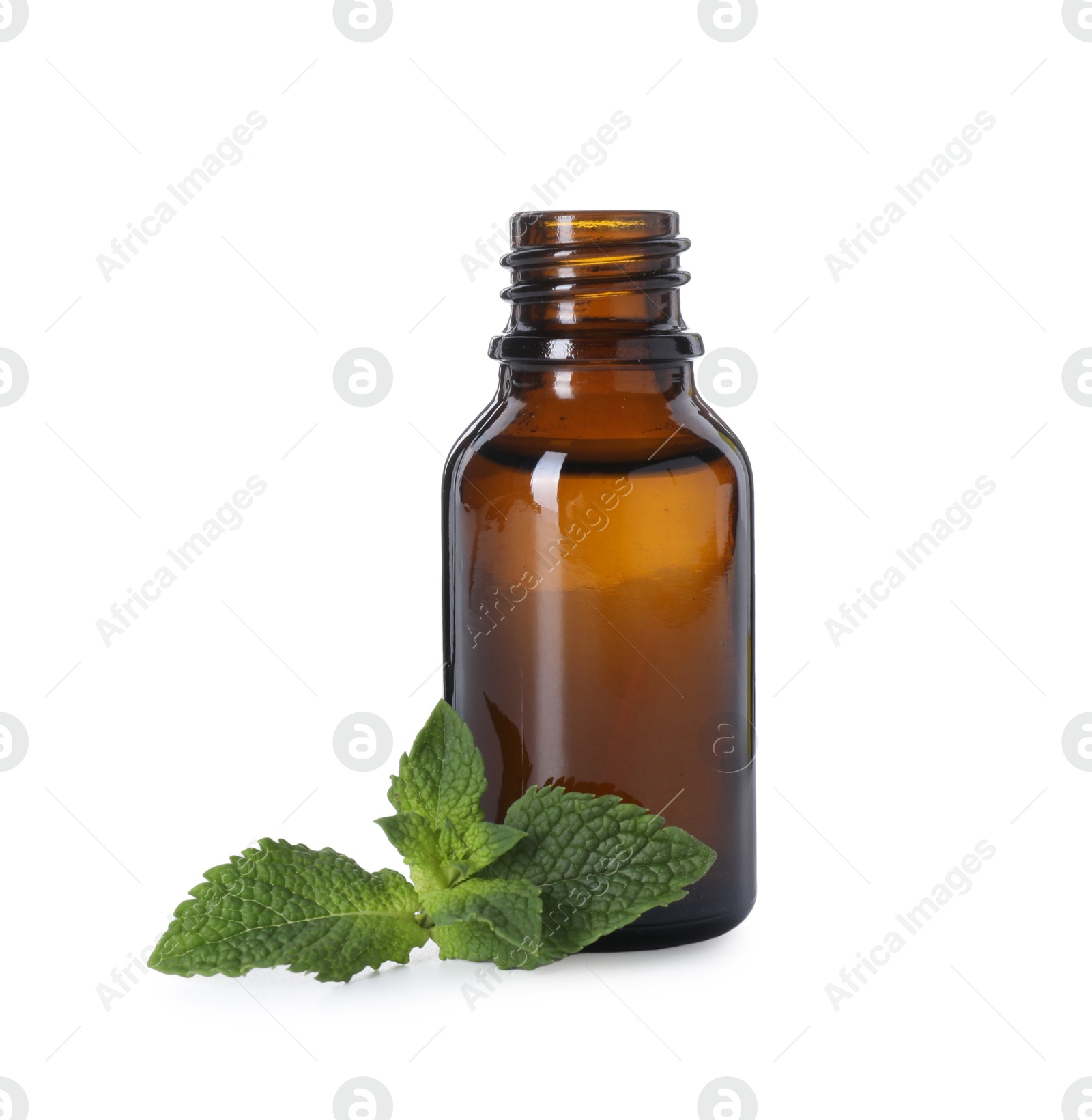 Photo of Bottle of essential oil and mint isolated on white