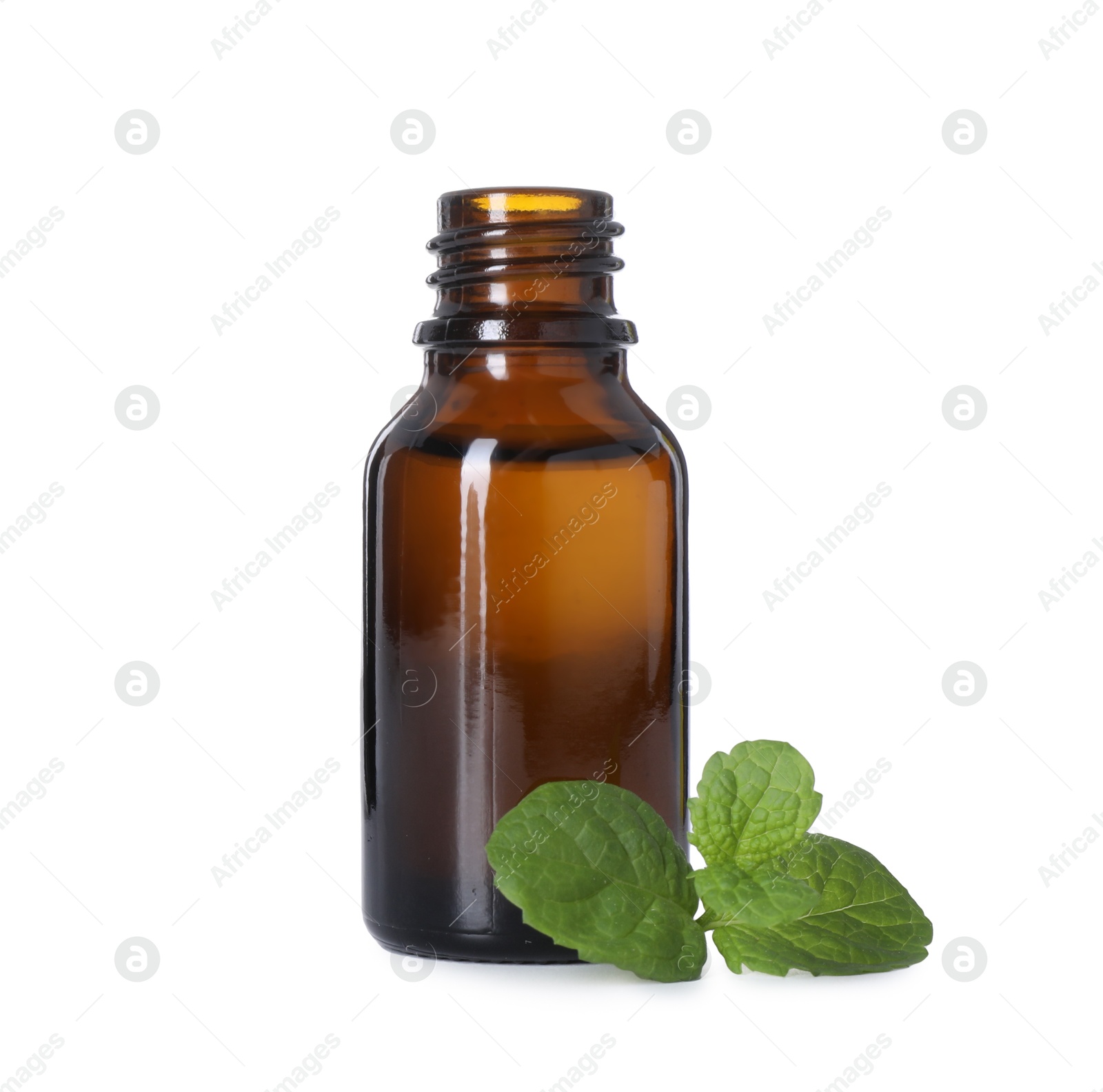 Photo of Bottle of essential oil and mint isolated on white