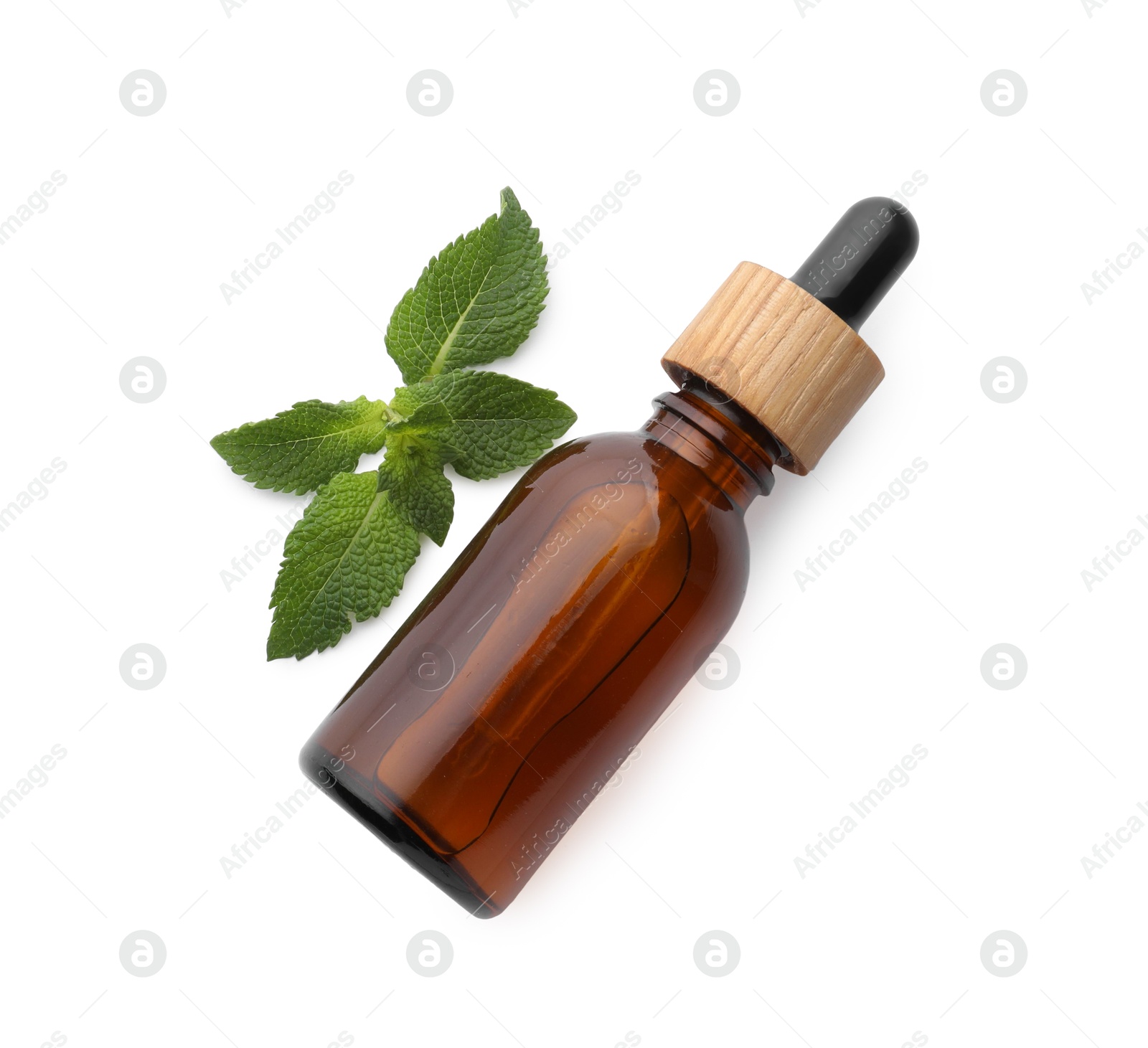 Photo of Bottle of essential oil and mint isolated on white, top view