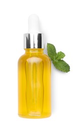 Photo of Bottle of essential oil and mint isolated on white, top view