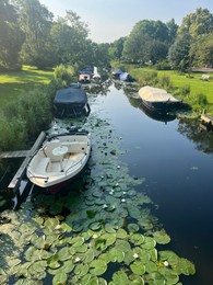 Photo of Picturesque view of canal with moored boats