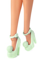 Image of Doll's legs with fancy shoes on white background