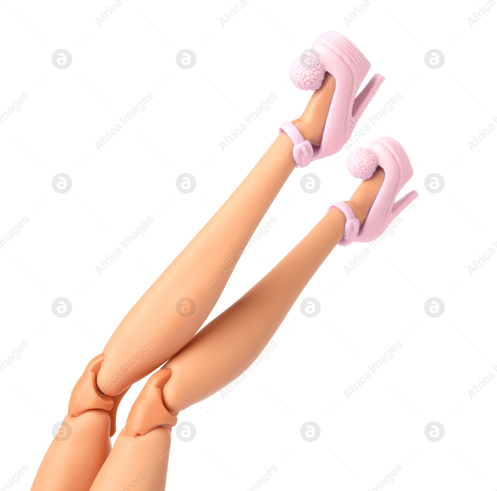 Image of Doll's legs with fancy shoes on white background