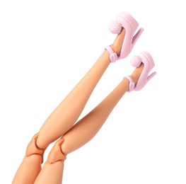 Image of Doll's legs with fancy shoes on white background