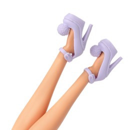 Image of Doll's legs with fancy shoes on white background