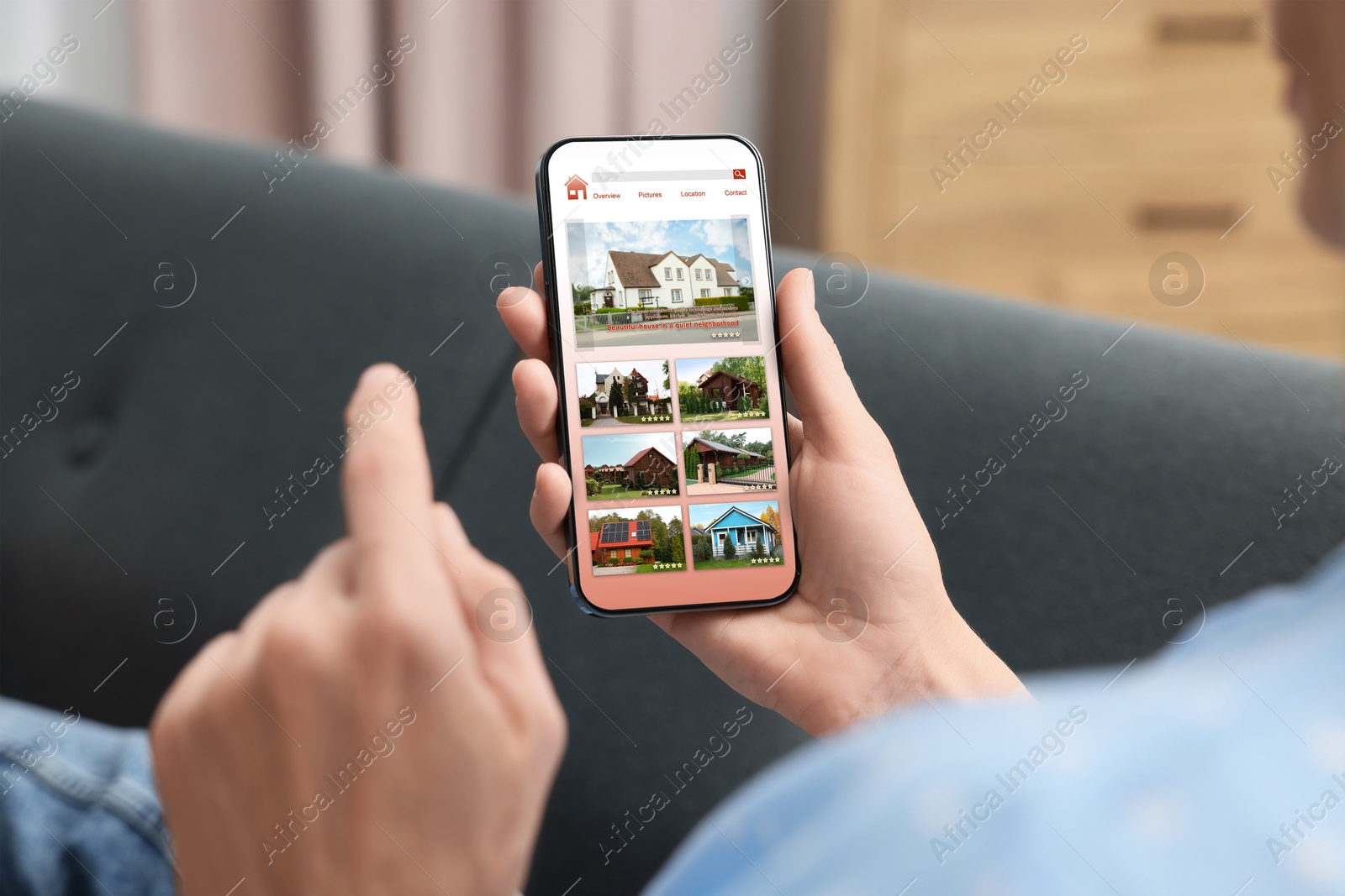 Image of Woman choosing dwelling on house hunting website via smartphone indoors, closeup