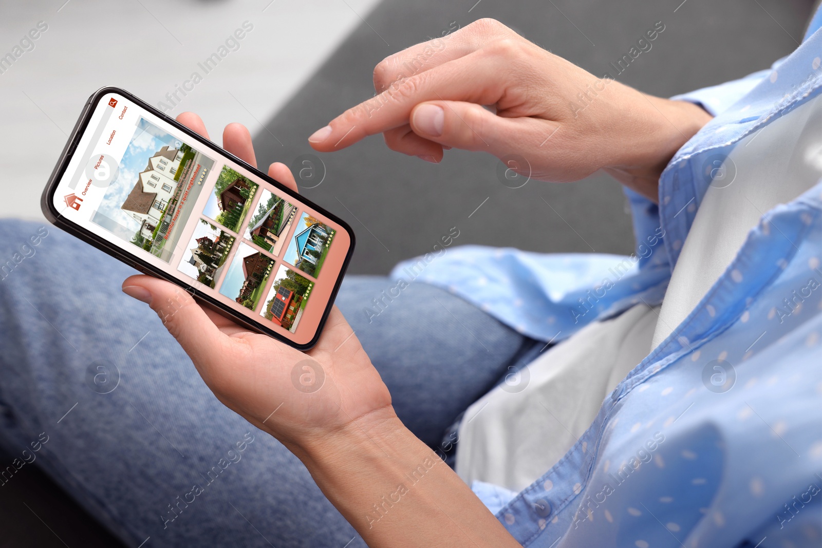 Image of Woman choosing dwelling on house hunting website via smartphone indoors, closeup