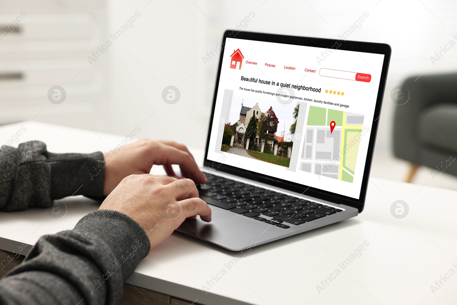 Image of Man choosing dwelling on house hunting website via laptop at table, closeup