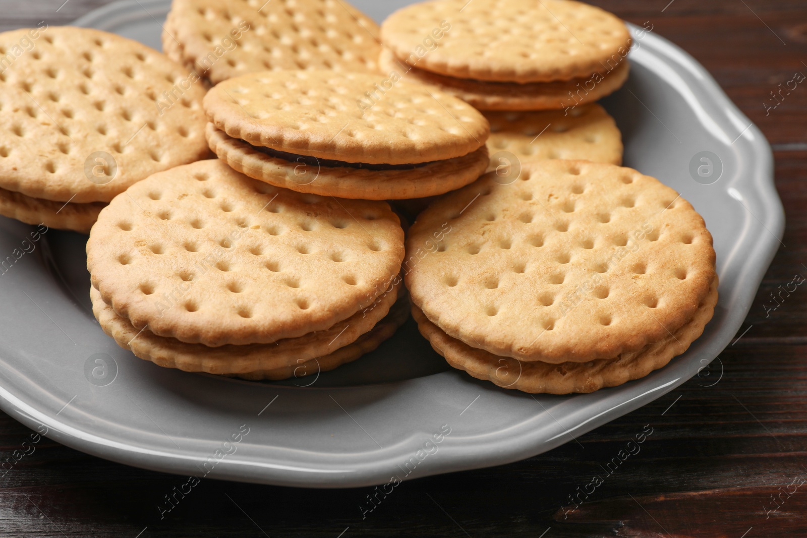 Photo of Fresh tasty sandwich cookies on table, closeup