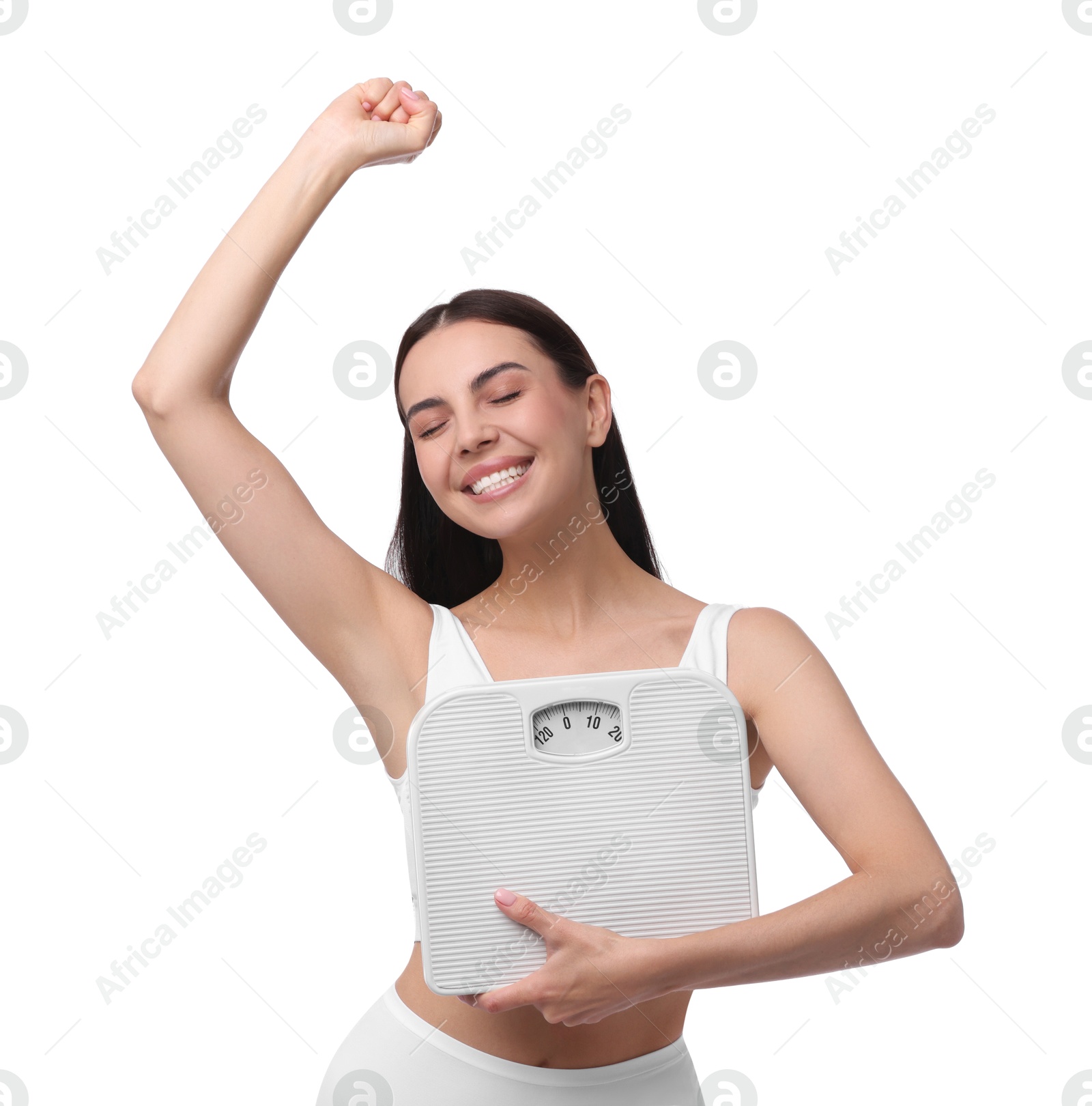 Photo of Diet and weight loss concept. Happy young woman with floor scale on white background