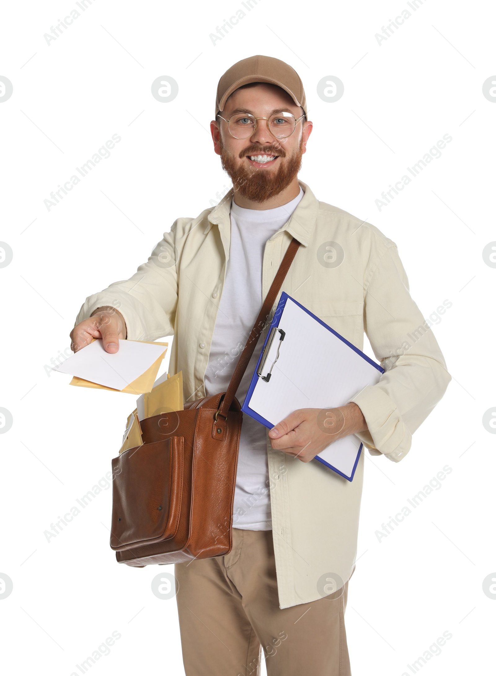 Photo of Happy young postman with brown bag delivering letters on white background