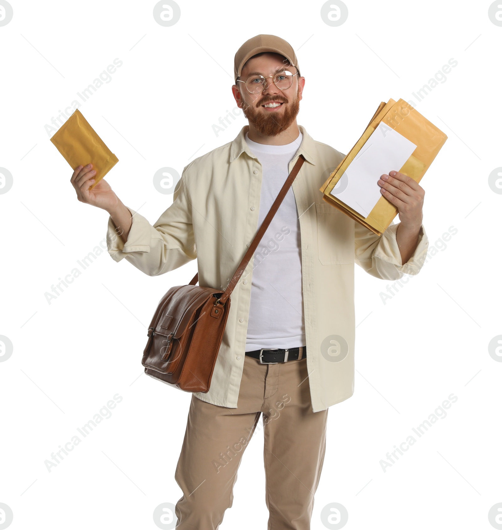 Photo of Happy young postman with brown bag delivering letters on white background