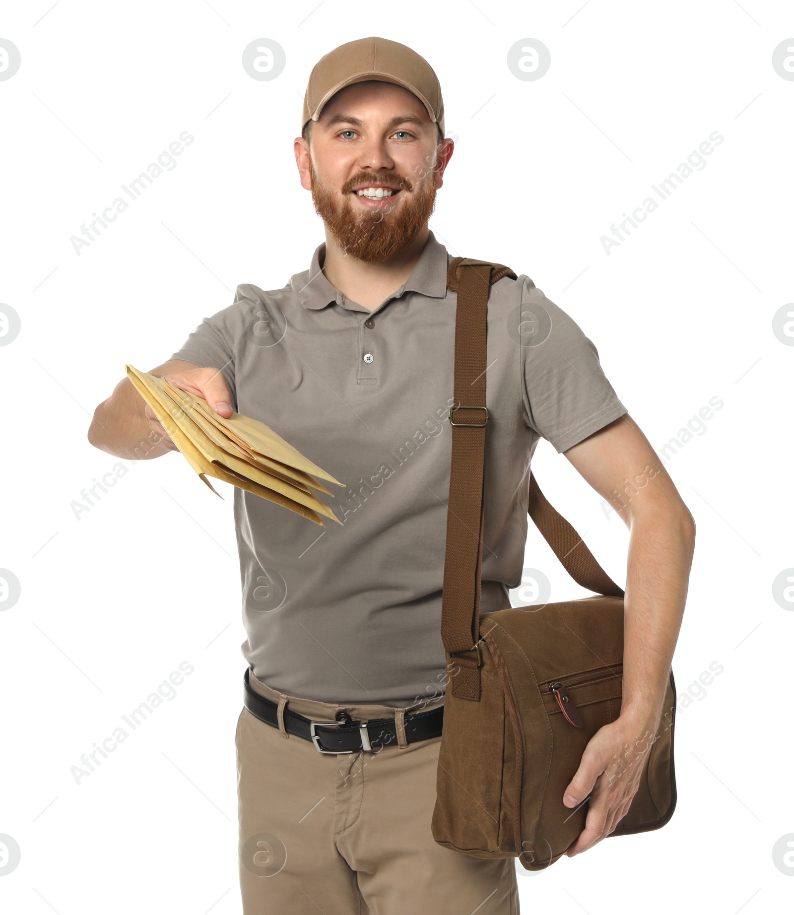 Photo of Happy young postman with brown bag delivering letters on white background