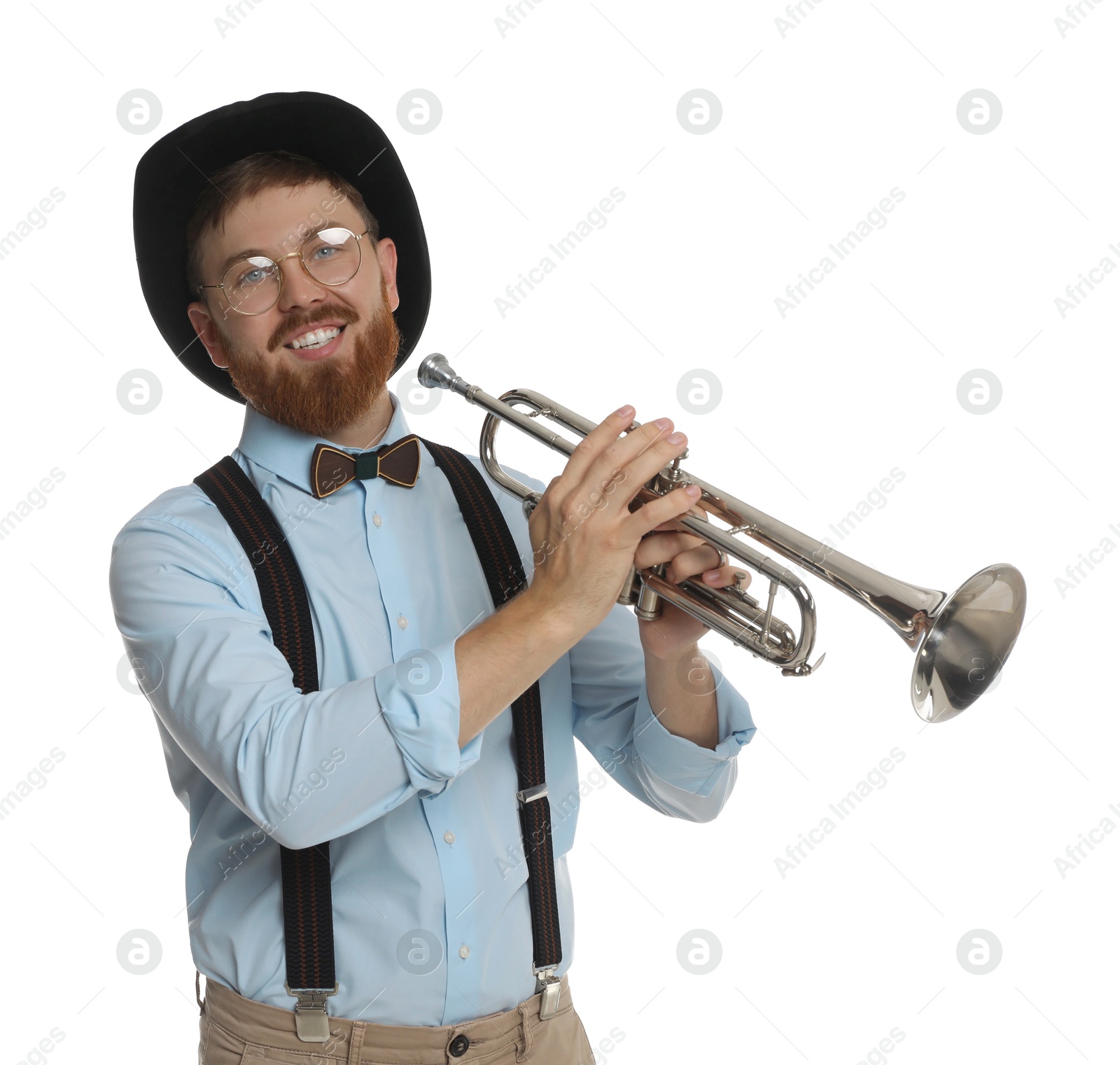 Photo of Smiling musician with trumpet on white background