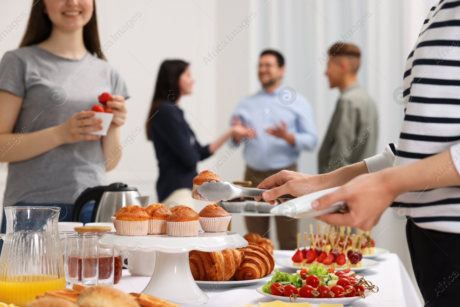 Photo of Coworkers having business lunch in restaurant, closeup