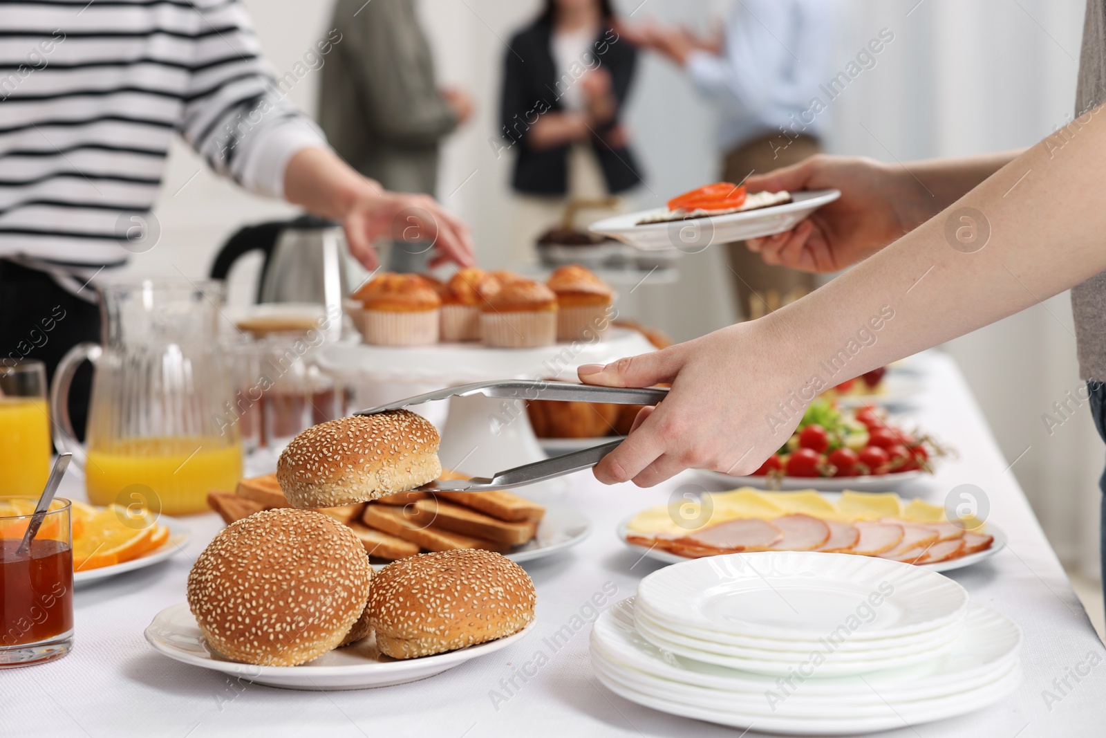 Photo of Coworkers having business lunch in restaurant, closeup