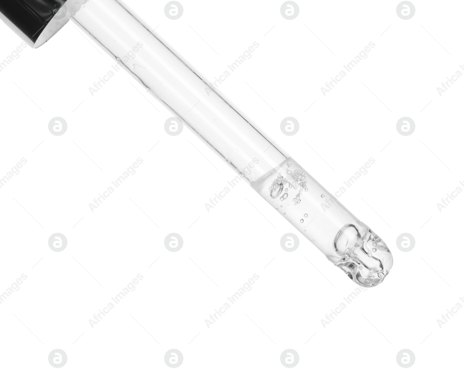 Photo of Dripping cosmetic serum from pipette on white background