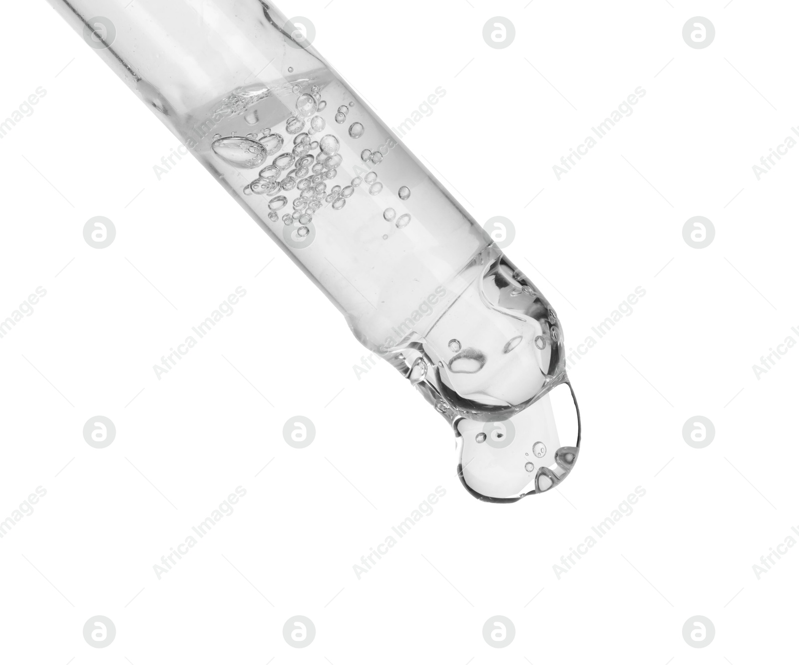 Photo of Dripping cosmetic serum from pipette on white background