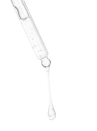 Photo of Dripping cosmetic serum from pipette on white background