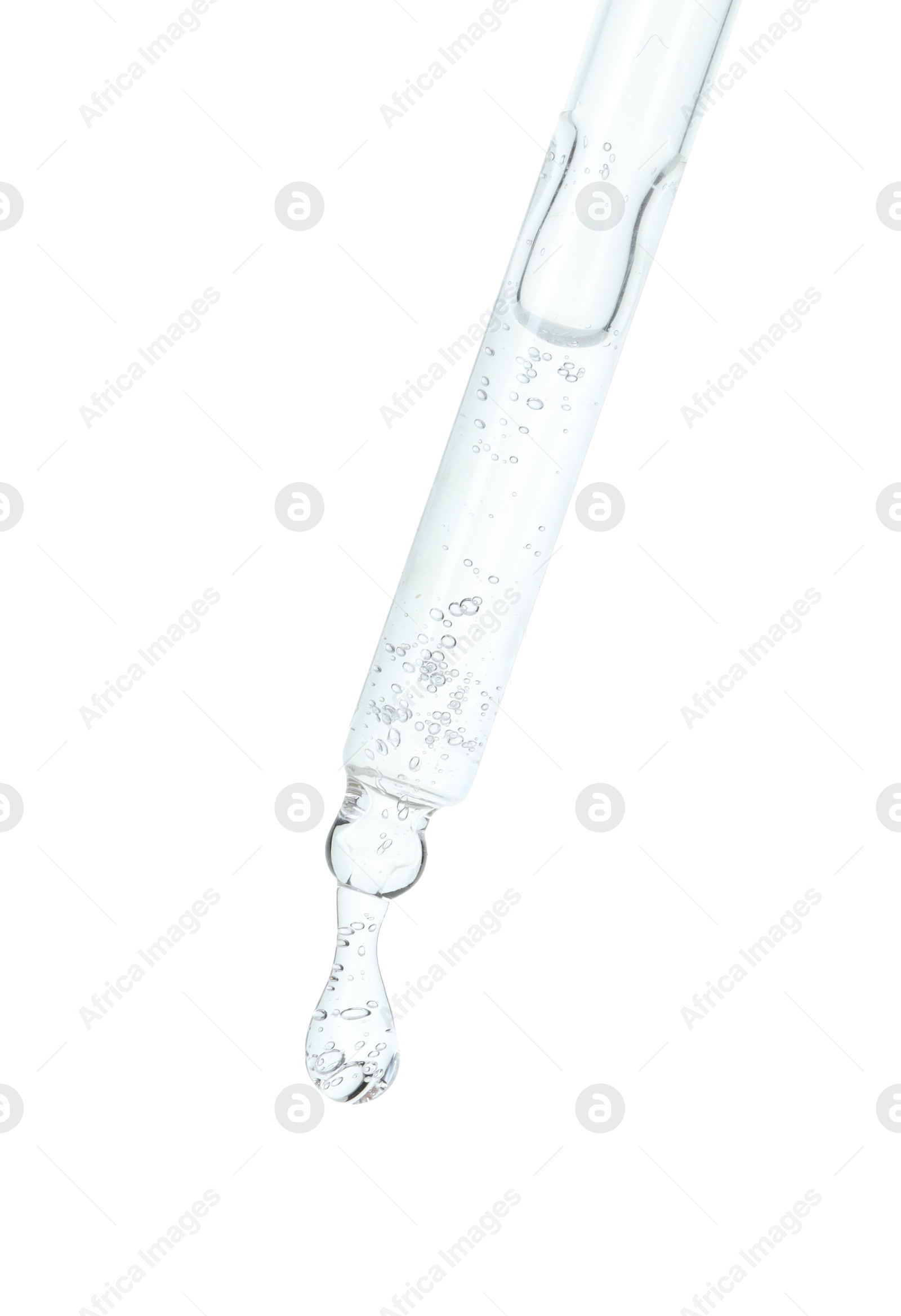 Photo of Dripping cosmetic serum from pipette on white background