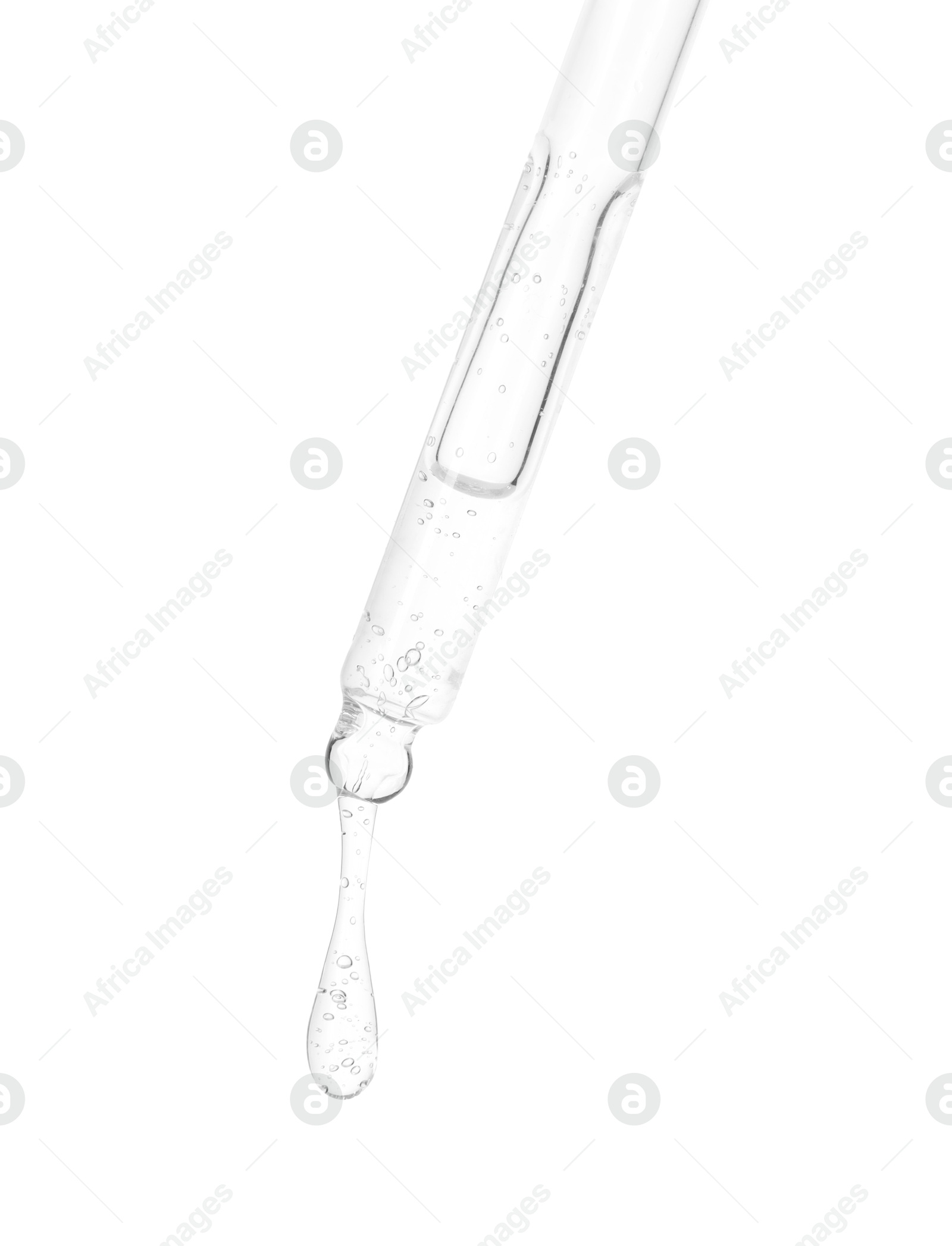 Photo of Dripping cosmetic serum from pipette on white background