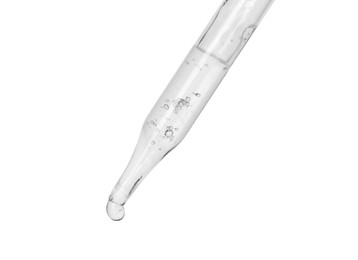 Photo of Dripping cosmetic serum from pipette on white background