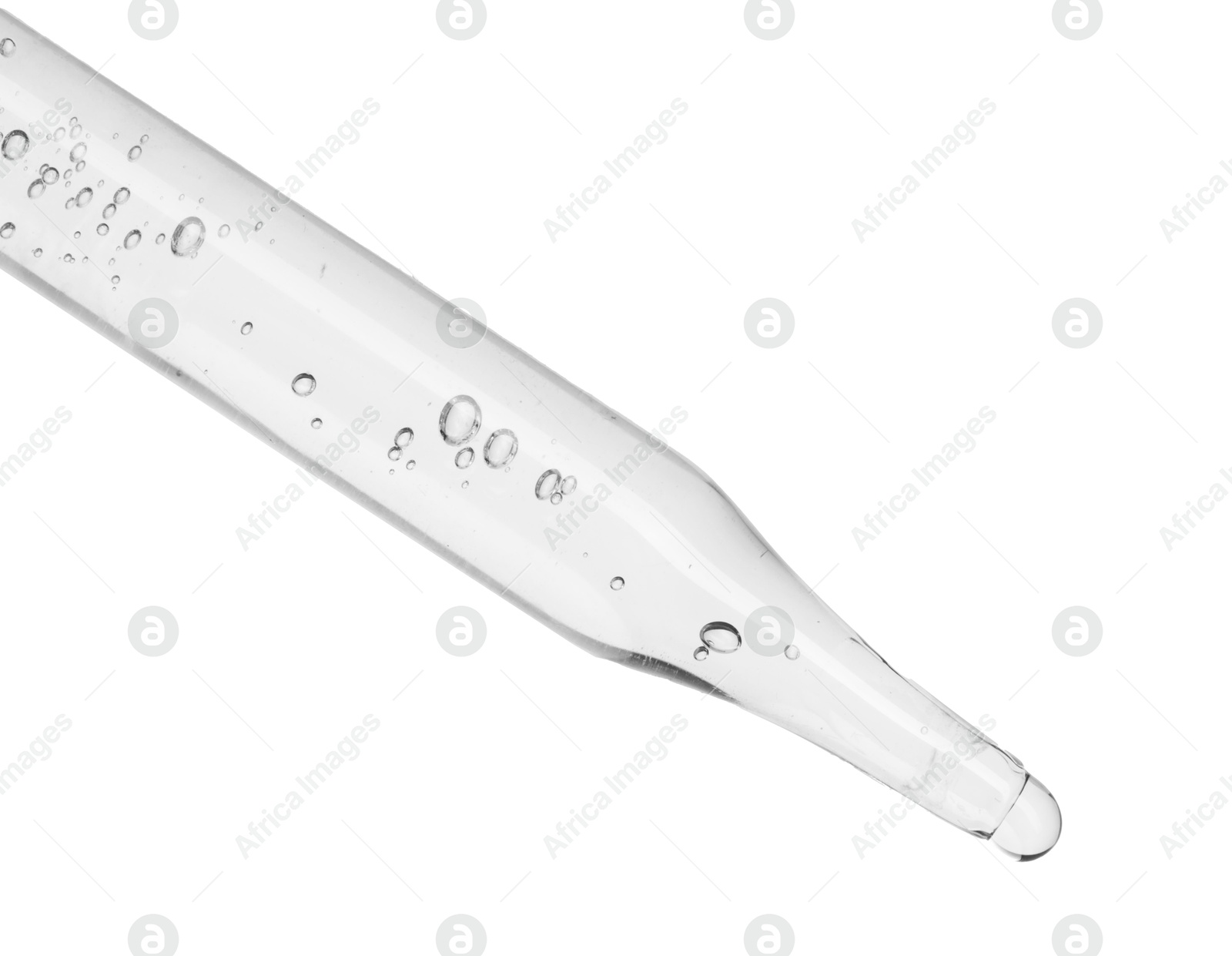 Photo of Dripping cosmetic serum from pipette on white background