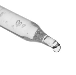 Dripping cosmetic serum from pipette on white background