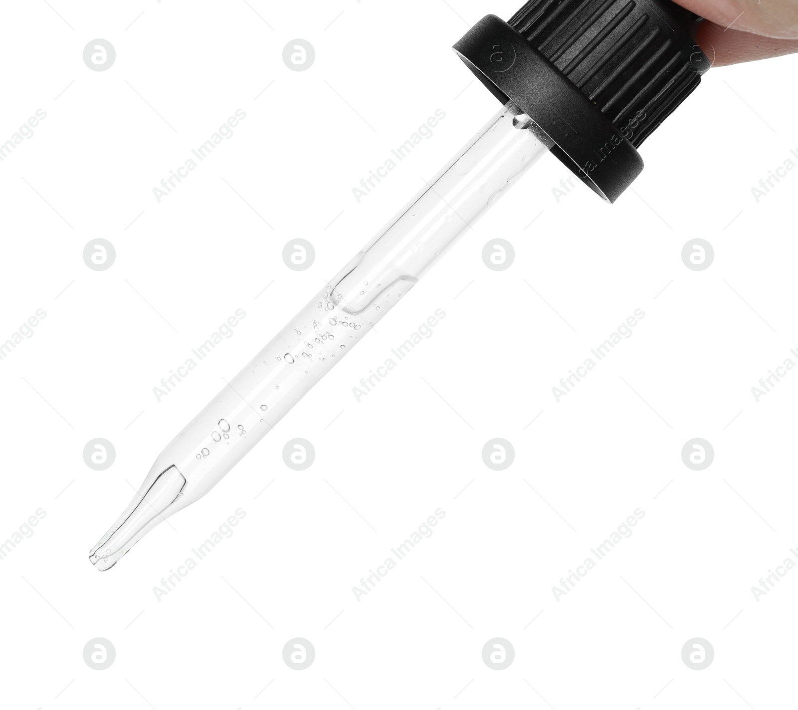 Photo of Dripping cosmetic serum from pipette on white background