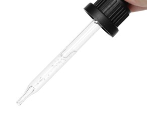 Dripping cosmetic serum from pipette on white background