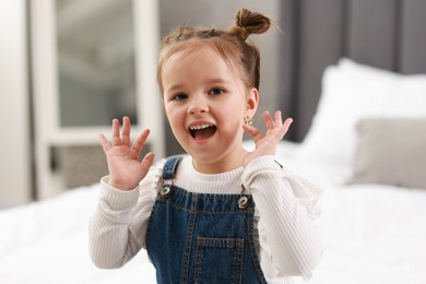 Photo of Portrait of emotional little girl indoors. Cute child