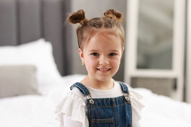 Portrait of happy little girl indoors. Cute child