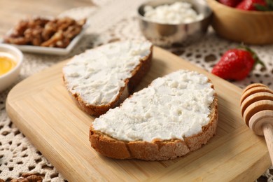 Delicious ricotta bruschettas and products on table, closeup