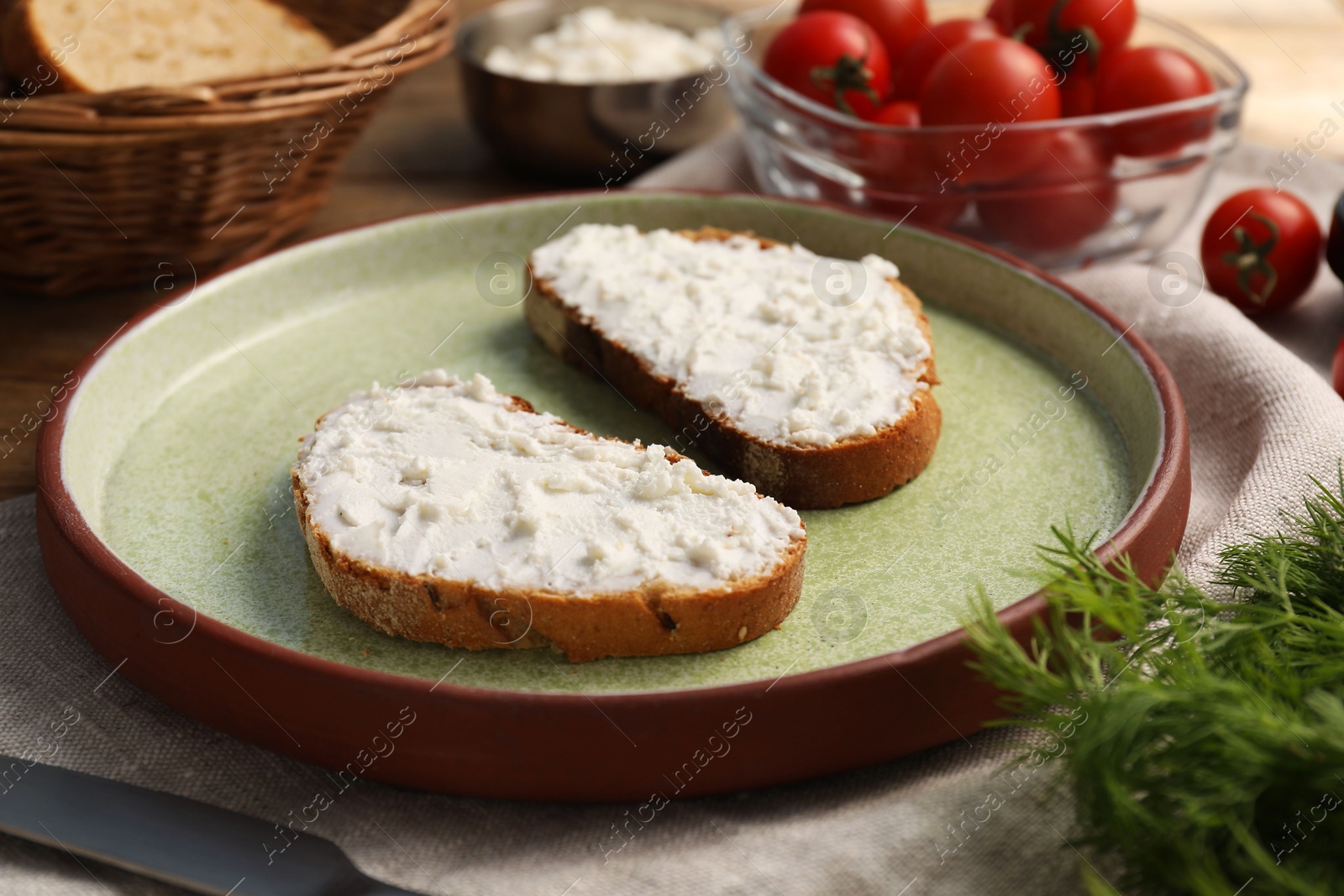 Photo of Delicious ricotta bruschettas and products on wooden table