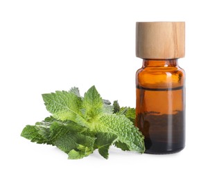 Photo of Bottle of essential oil and mint isolated on white